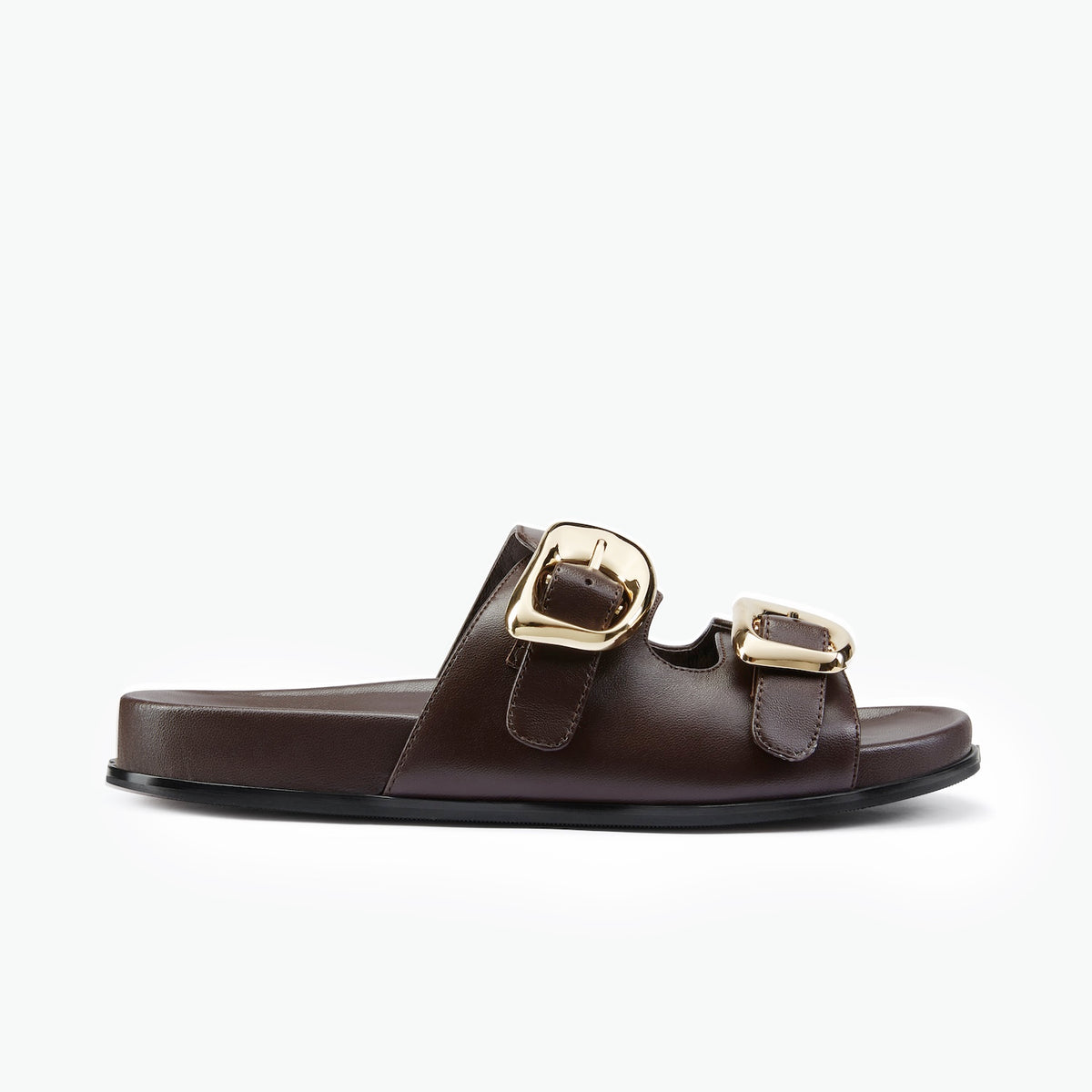 A single brown leather foam slide sandal shown from a side profile view against a solid white background.