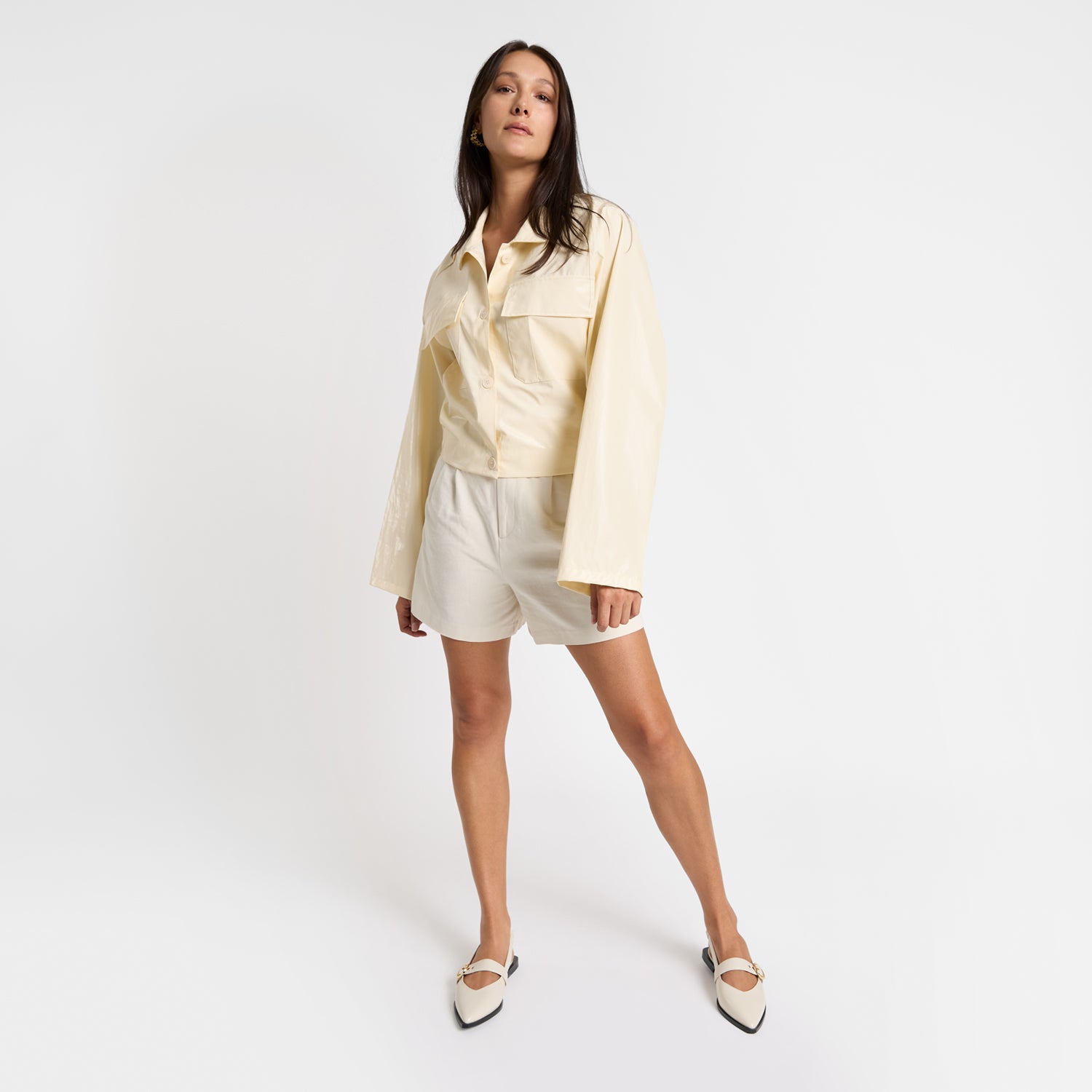 Model wears Valencia ivory sling back.