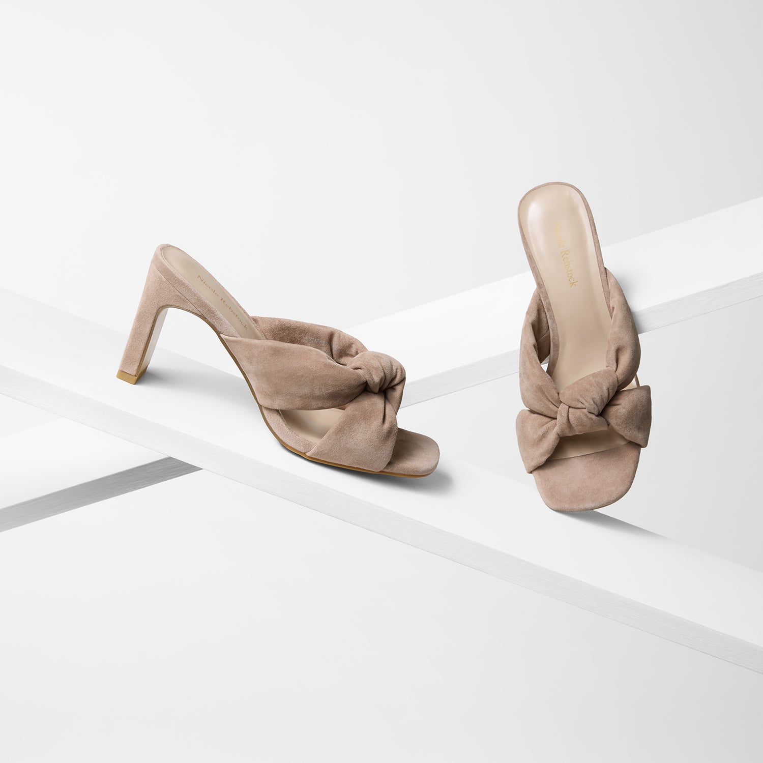 Velma dirty blush suede sandals with a rectangular heel and knotted strap detail shown from all sides.