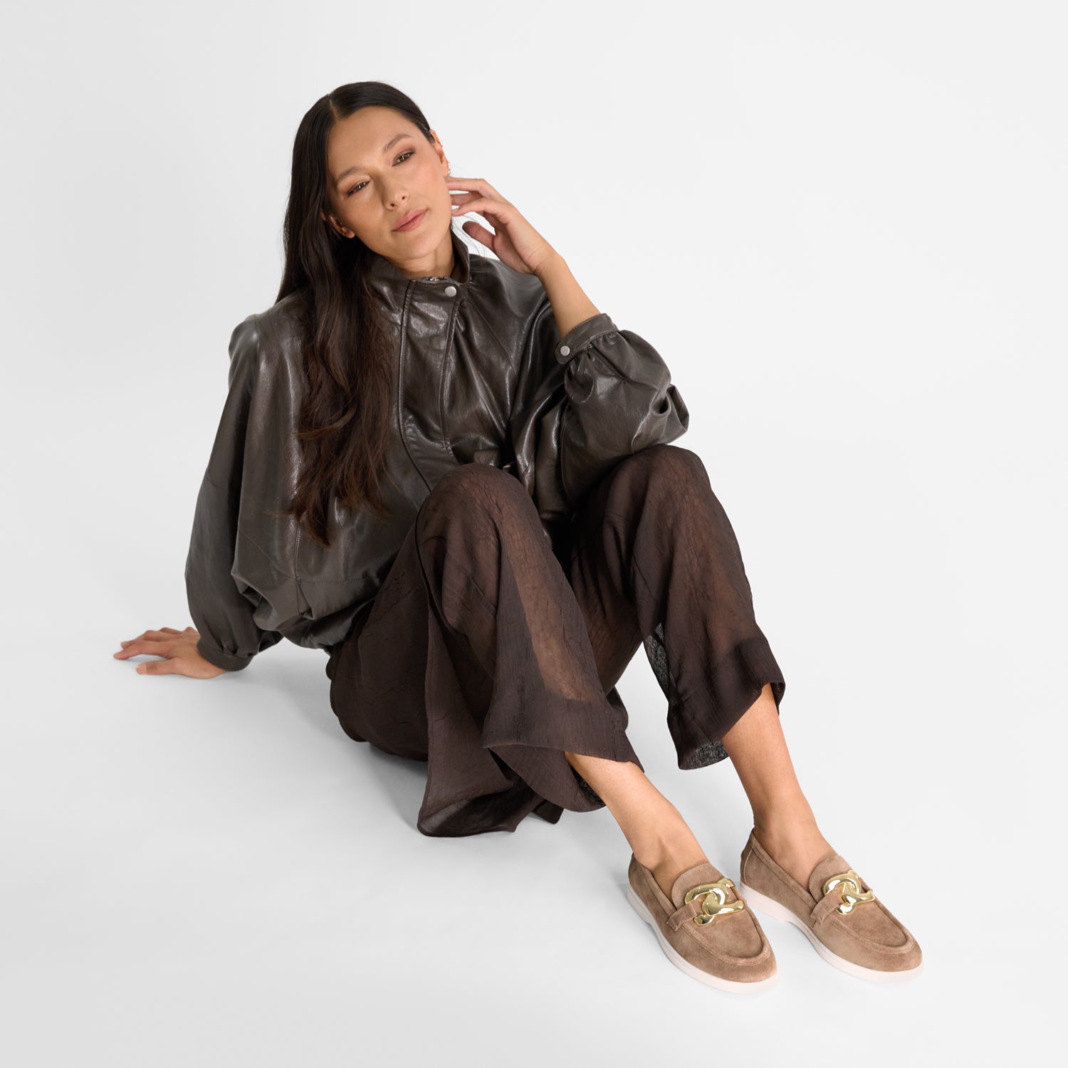 woman wearing Nicole Rebstock's coco suede loafers with white sole and round toe.
