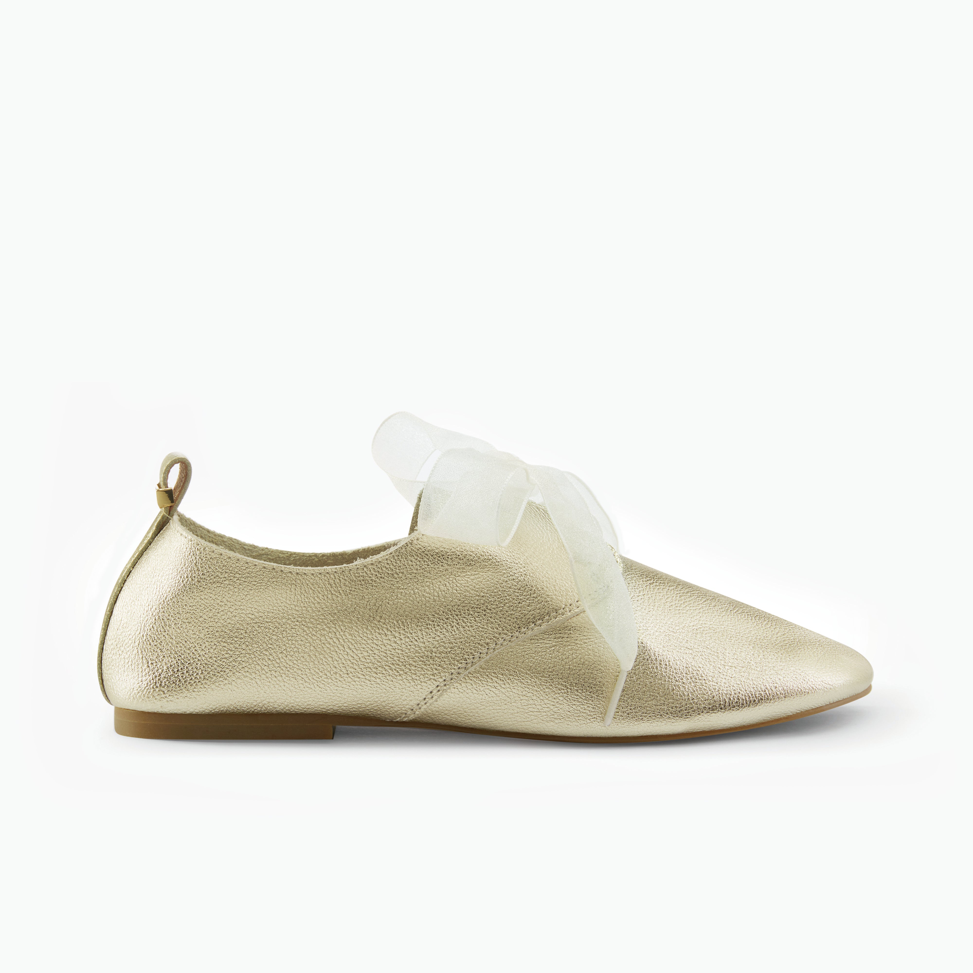 Gold metallic flat shoe with a sheer ribbon on a white background