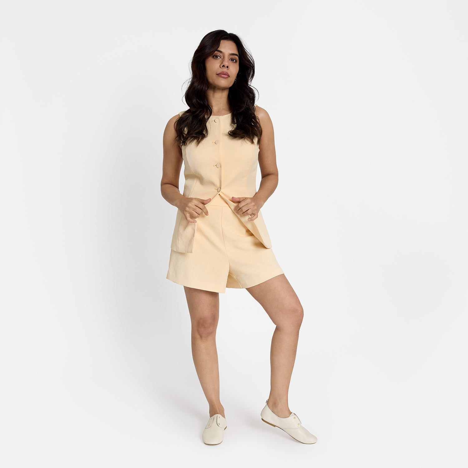 model wears women's Xeno ivory slip on house shoe