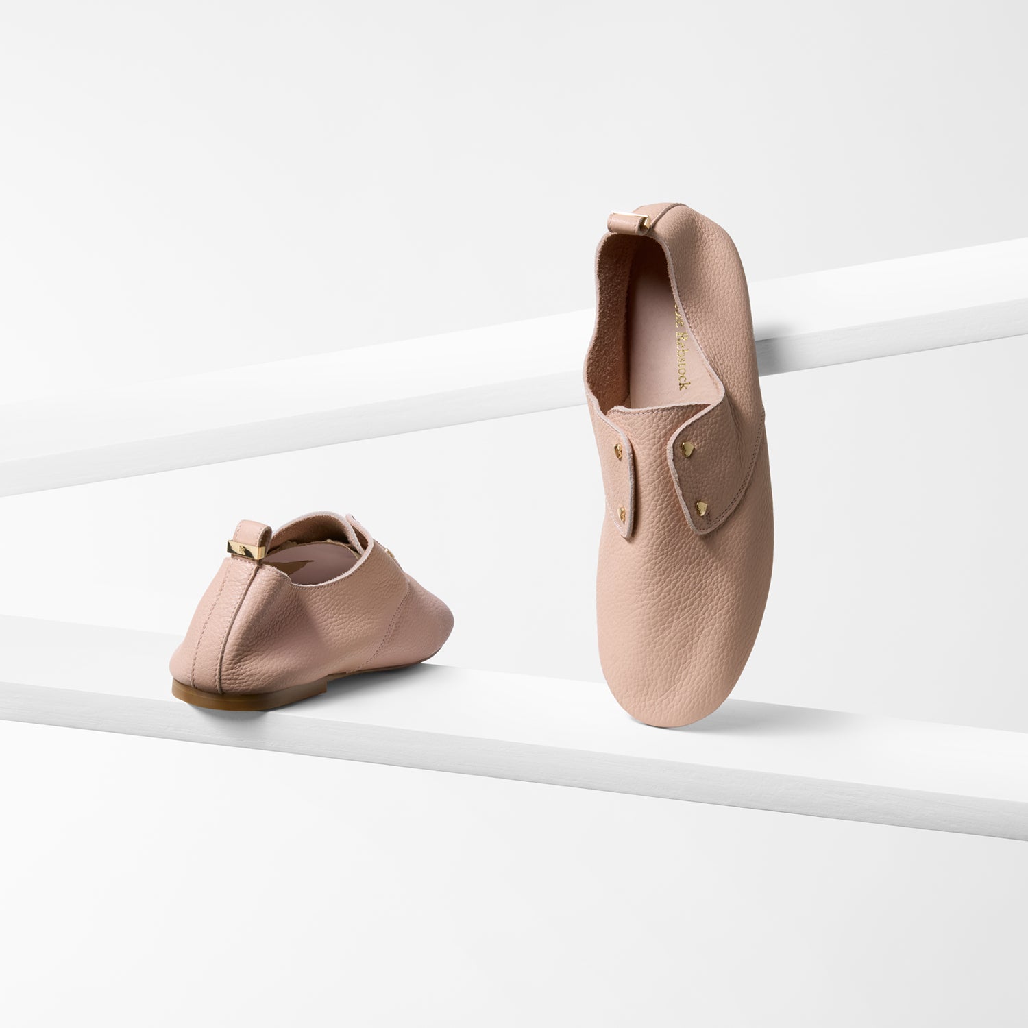 soft unstructured pink pastel flats by Nicole Rebstock with gold heart studs.