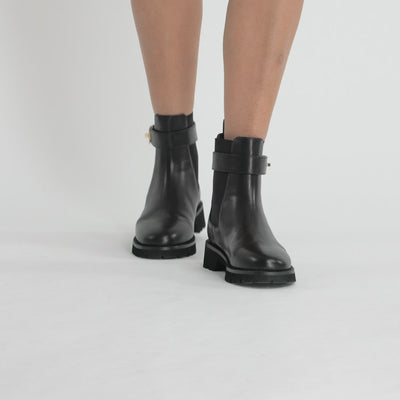 Video of Jasper Black Leather Ankle Boots by Nicole Rebstock.