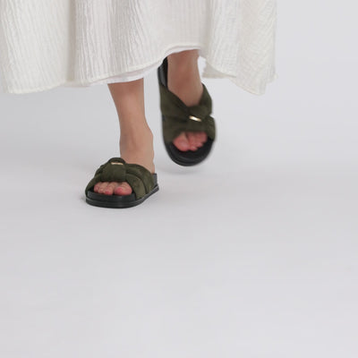 Video of model wearing Nicole Rebstock olive green Uno 2.0 slides.