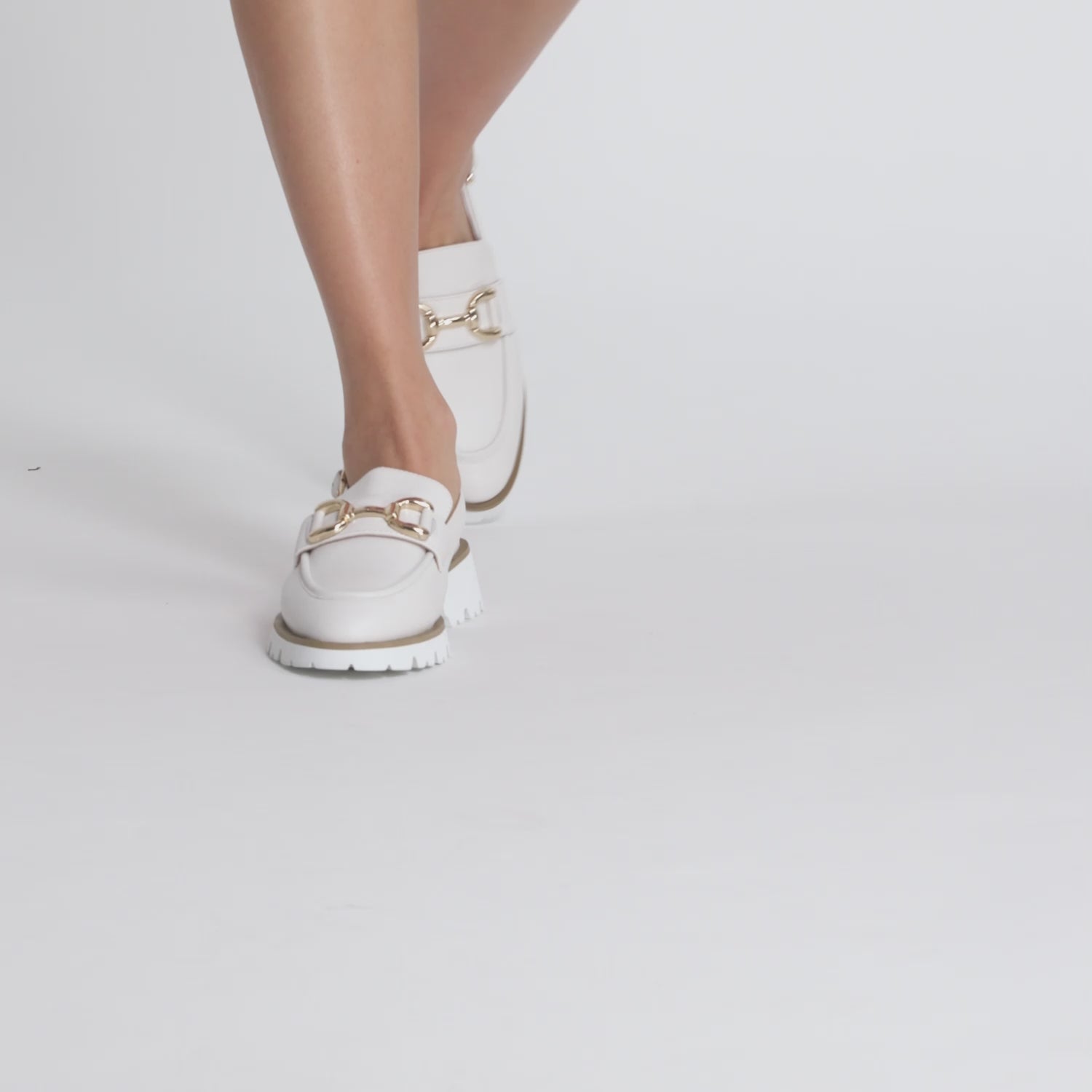 Video of model wearing off-white calipso slingback flat with chunky sole