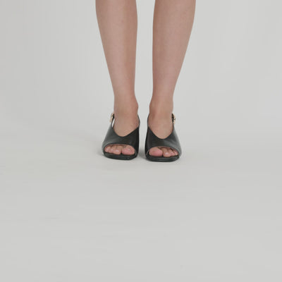 Video of Nicole Rebstock's Andy Sandal in Black high gloss leather.